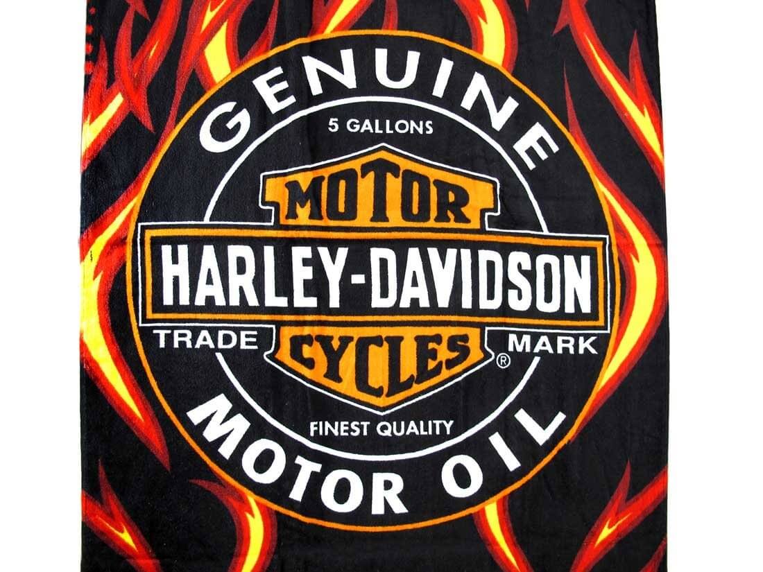 Genuine Motor Cycles beach towel with flaming background closeup
