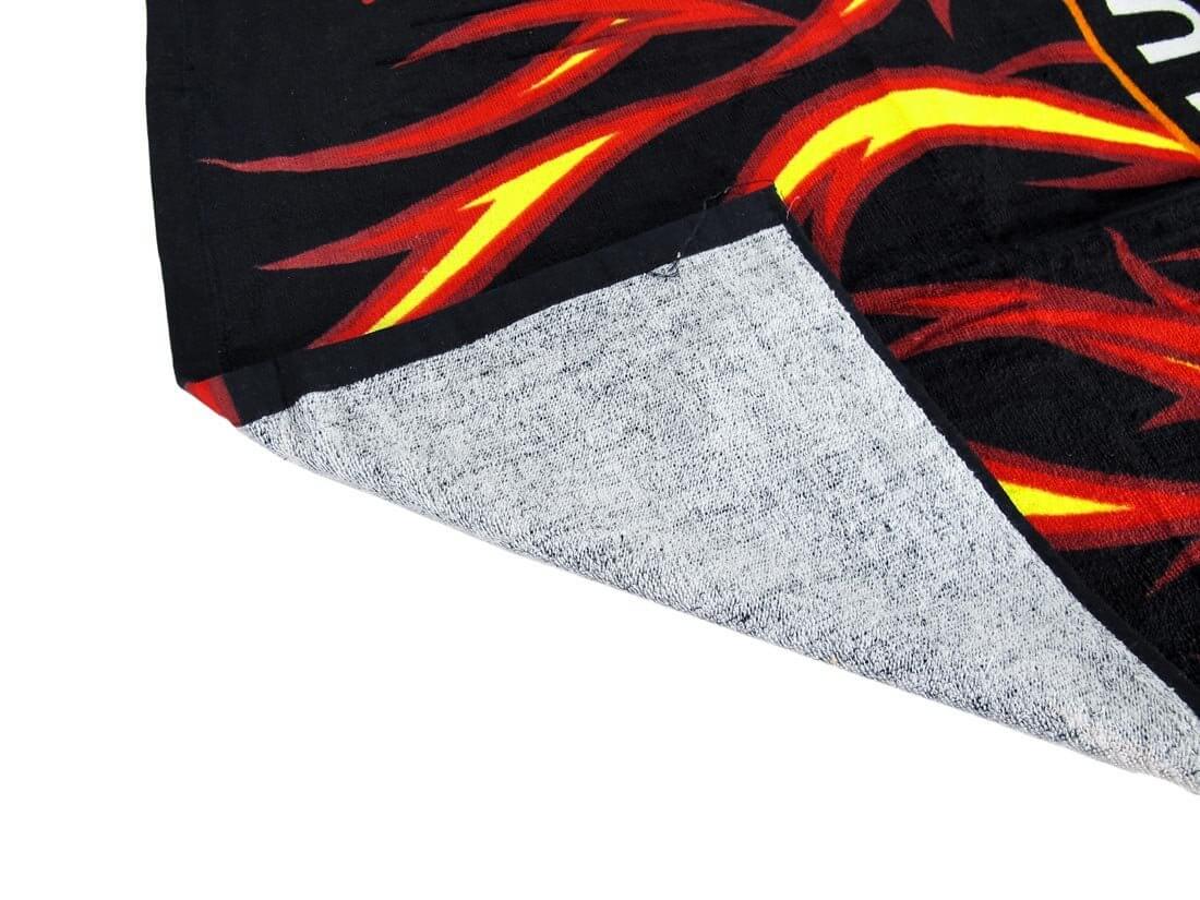 Genuine Motor Cycles beach towel with flaming background folded