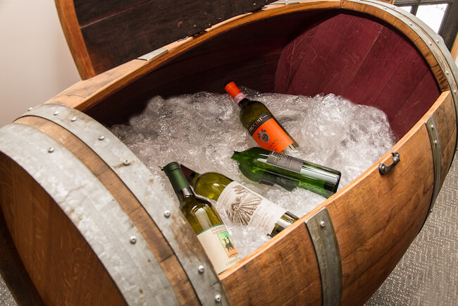wine resting inside the ice chest barrel 